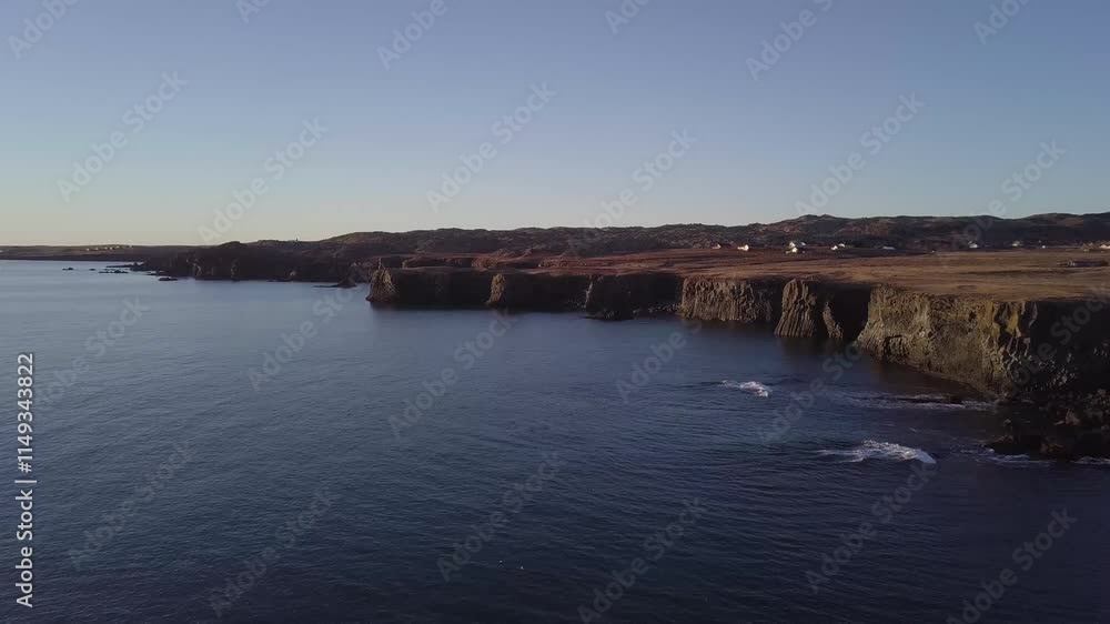 Drone aerial landscape winter view of the ocean with sunrise scene on Arnarstapi, Iceland Drone aerial landscape winter view of the ocean with sunrise scene on Arnarstapi, Iceland