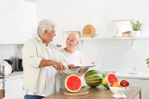 Mature couple cutting water...