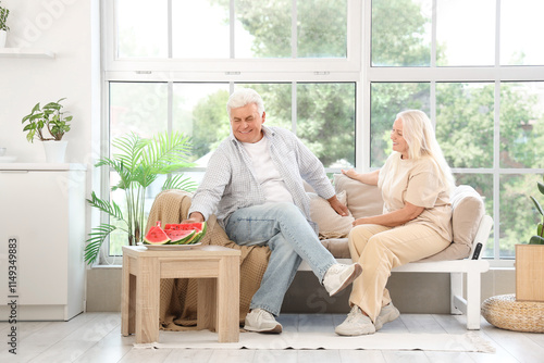 Mature couple with watermel...