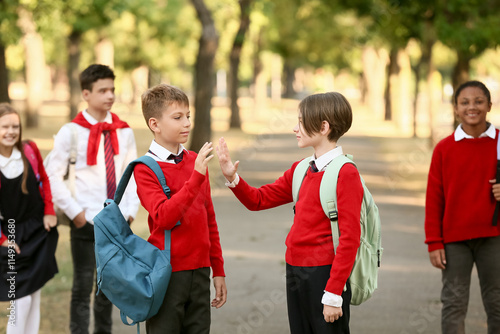 Group of happy pupils givin...