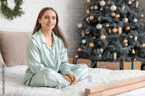 Young happy woman sitting o...
