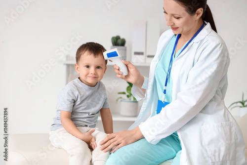 Pediatrician checking a smi...