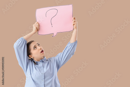 Puzzled woman holding paper...