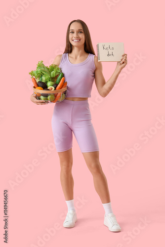 Sporty young woman holding ...