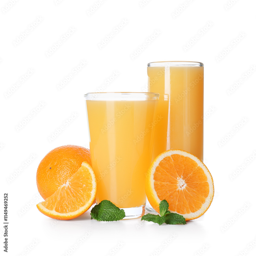 Glasses of tasty juice with oranges and mint leaves on white background Glasses of tasty juice with oranges and mint leaves on white background