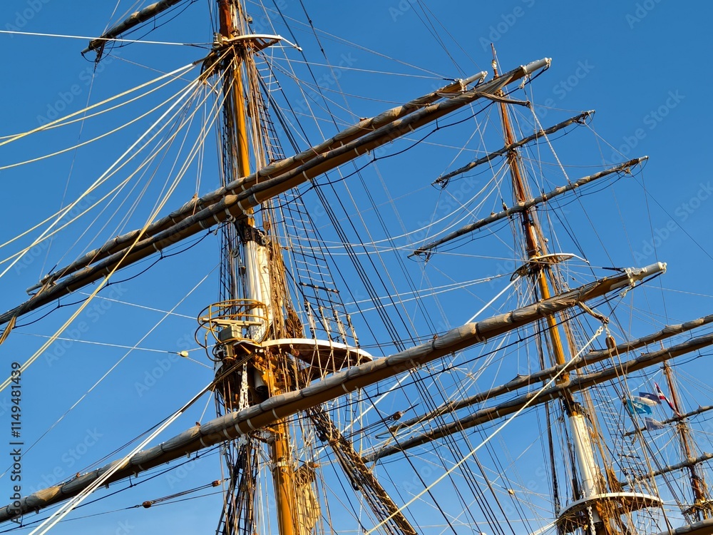 Ropes stretched across the masts of an old ship Ropes stretched across the masts of an old ship