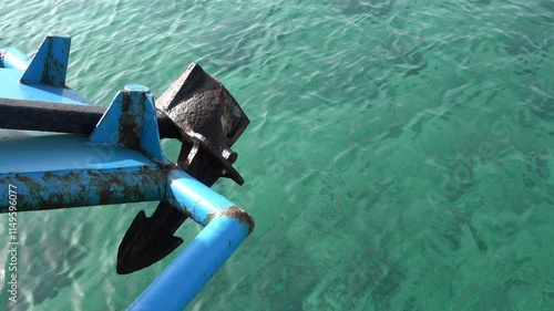 Rusty ship anchor. Close up of a rusty ship anchor that is moving over the sea surface