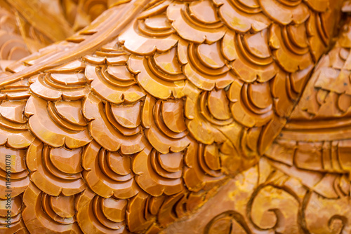 Buddhist Lent tradition, a beautiful display of wisdom, beeswax candles create art as a Buddhist offering.Background with Thai pattern carved on the surface of a Buddhist Lent candle.Ubon Ratchathani. photo