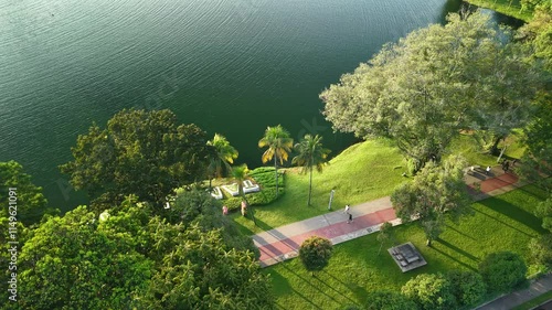 aerial view of kuala lumpur in the background with beautiful morning lark park scenery people jog
