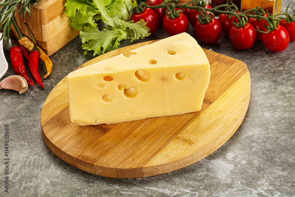 Swiss Maasdam cheese triangle over board Swiss Maasdam cheese triangle over board