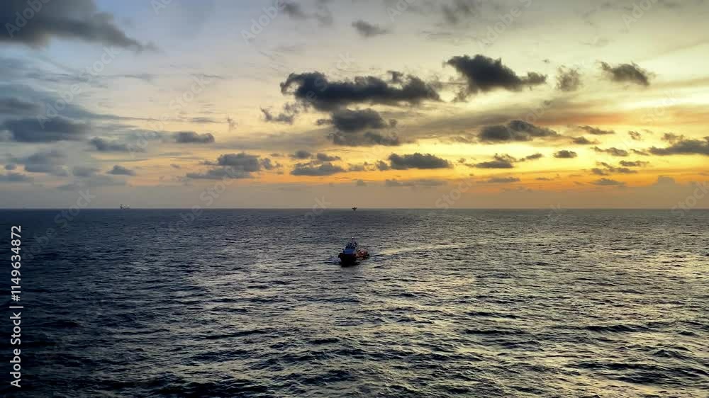 Crew boat is travelling for transport people, equipment, and supplies to and from offshore facilities, such as oil and gas platforms and wind farms Crew boat is travelling for transport people, equipment, and supplies to and from offshore facilities, such as oil and gas platforms and wind farms