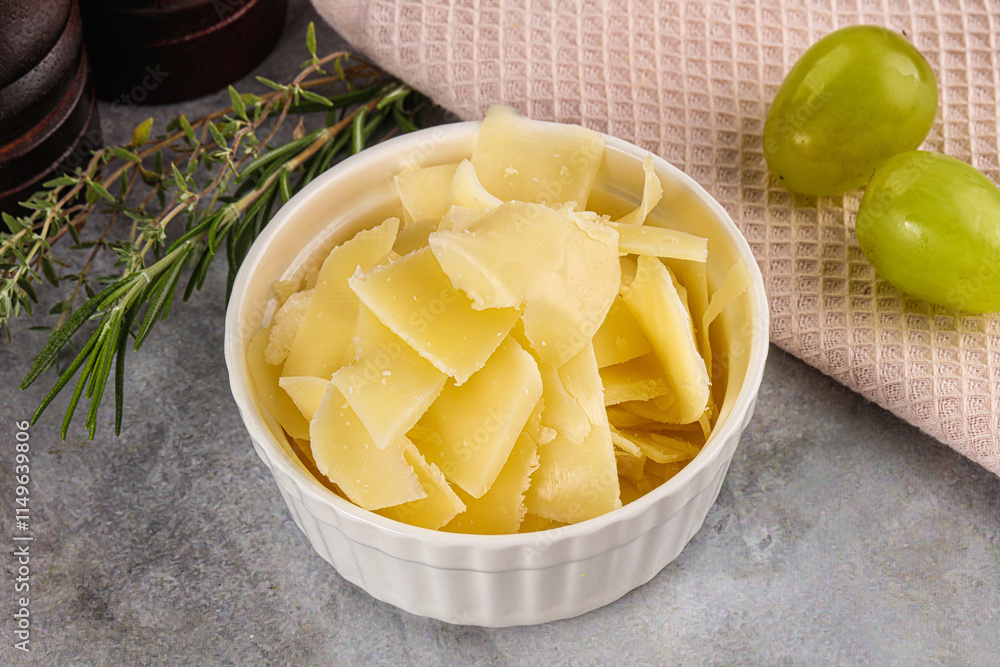 Parmesan cheese slices in the bowl Parmesan cheese slices in the bowl