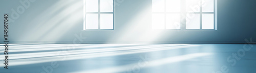 Bright and airy interior with sunlight streaming through large windows, creating a serene atmosphere.