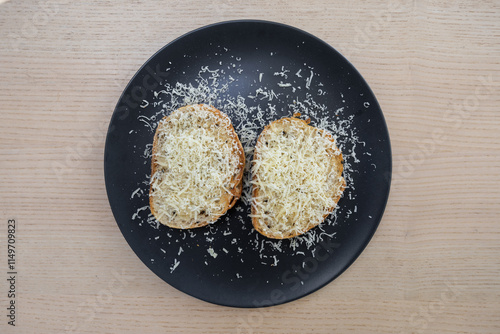 Bread topped with grated cheese.