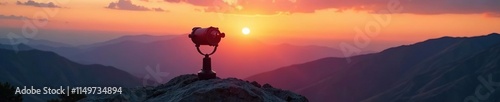 Binoculars positioned on top of a rocky outcropping at sunset with a panoramic view, peregrinated, point, binoculars photo