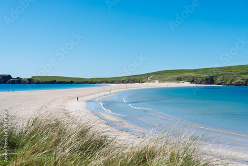 St Ninian's Beach with crystal-clear water and a blue sky in Shetland photo