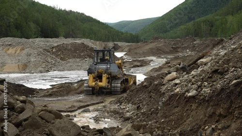 August 15, 2020 - Amur Region, Russia - Placer gold mining. Machinery works on the river, mining placer gold.
