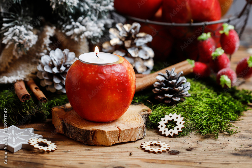 Florist at work: woman shows how to make a Christmas decoration with apple, candle and branches of fir. Step by step, tutorial.
