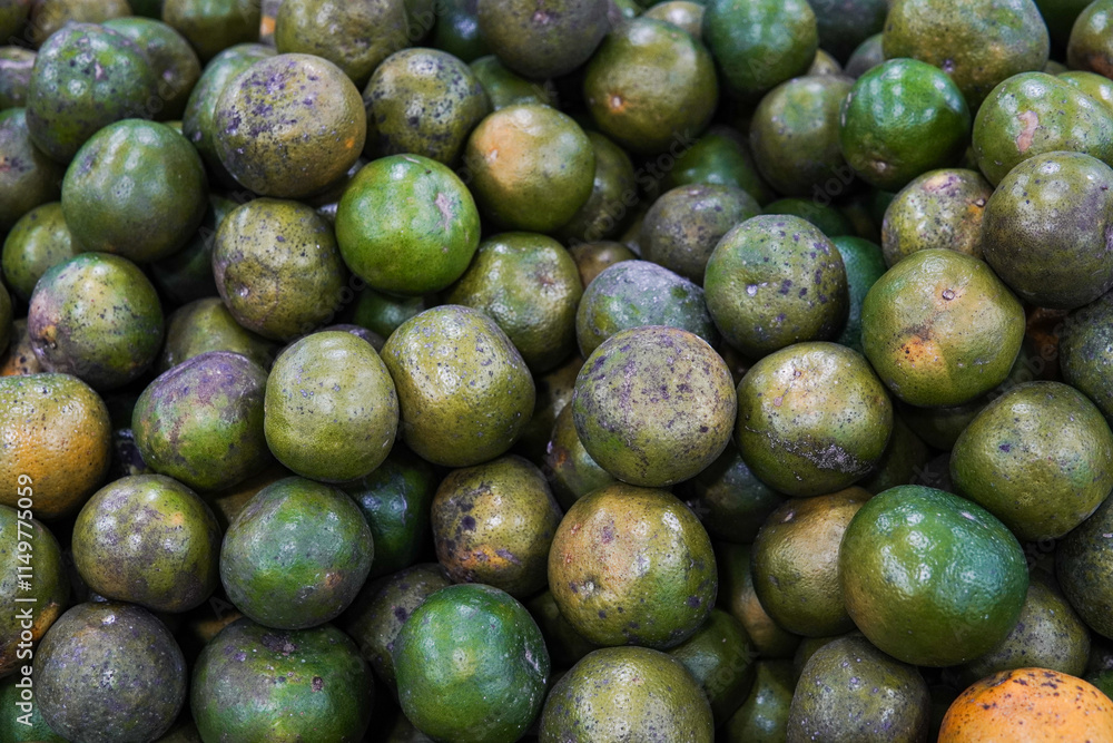 Green sweet oranges in a fruit shop are suitable for use in poster designs, or as illustrations for articles about fruits. Green sweet oranges in a fruit shop are suitable for use in poster designs, or as illustrations for articles about fruits.