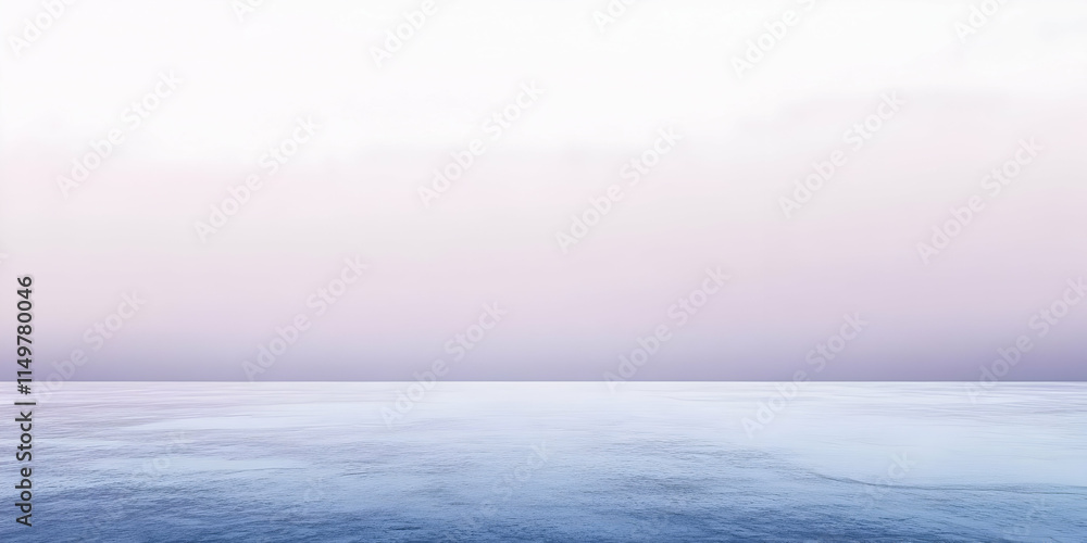 Obraz premium Tranquil seascape at dawn, showcasing a calm ocean and soft pastel sky.