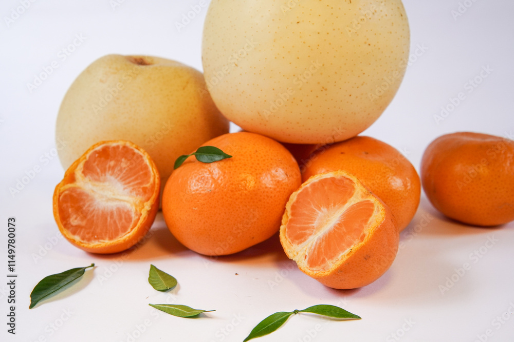 The concept of Tangerine or Mandarin orange with Grapes and Pears on a white background is suitable for design needs, as an illustration for articles about fruits and others. The concept of Tangerine or Mandarin orange with Grapes and Pears on a white background is suitable for design needs, as an illustration for articles about fruits and others.