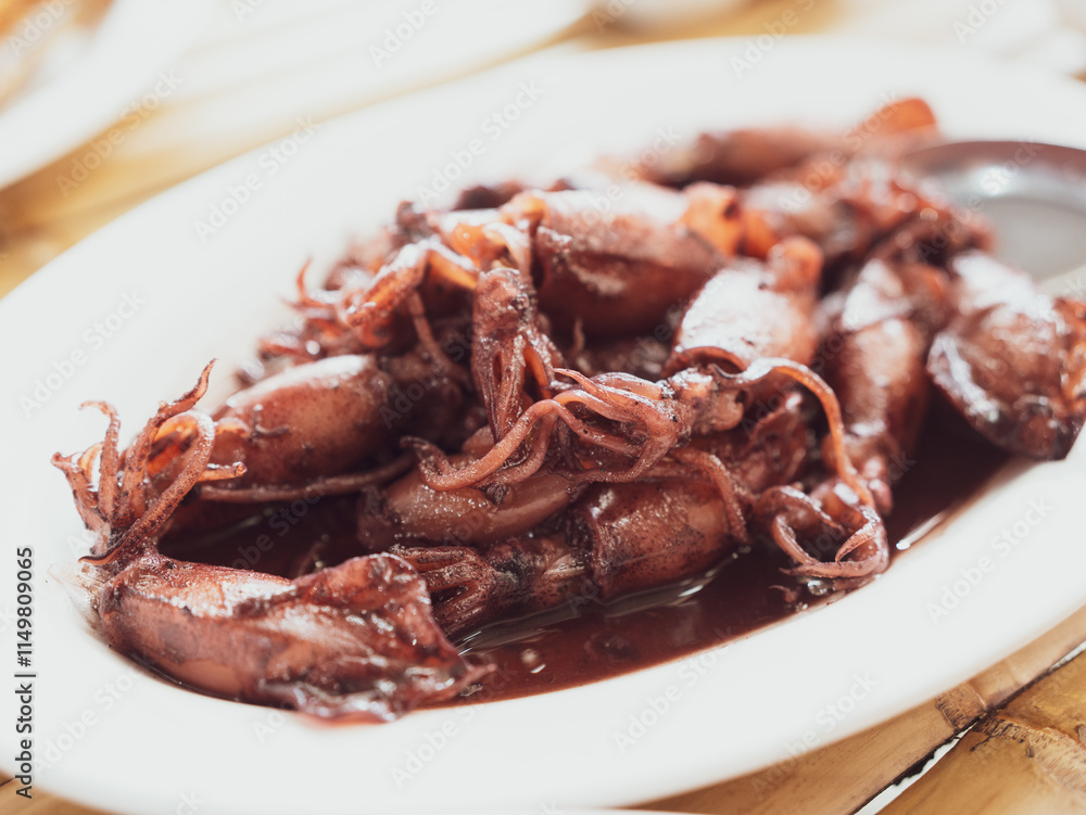 Squid black or Sauteed black squid is processed squid that is cooked until the squid ink is released. The resulting taste is very distinctive. Processed squid. Thai seafood style. Squid black or Sauteed black squid is processed squid that is cooked until the squid ink is released. The resulting taste is very distinctive. Processed squid. Thai seafood style.
