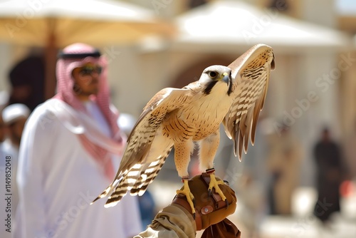 A falconry display in Riyadh, showcasing the cultural heritage of Saudi Arabia with skilled falconers and their majestic birds of prey.