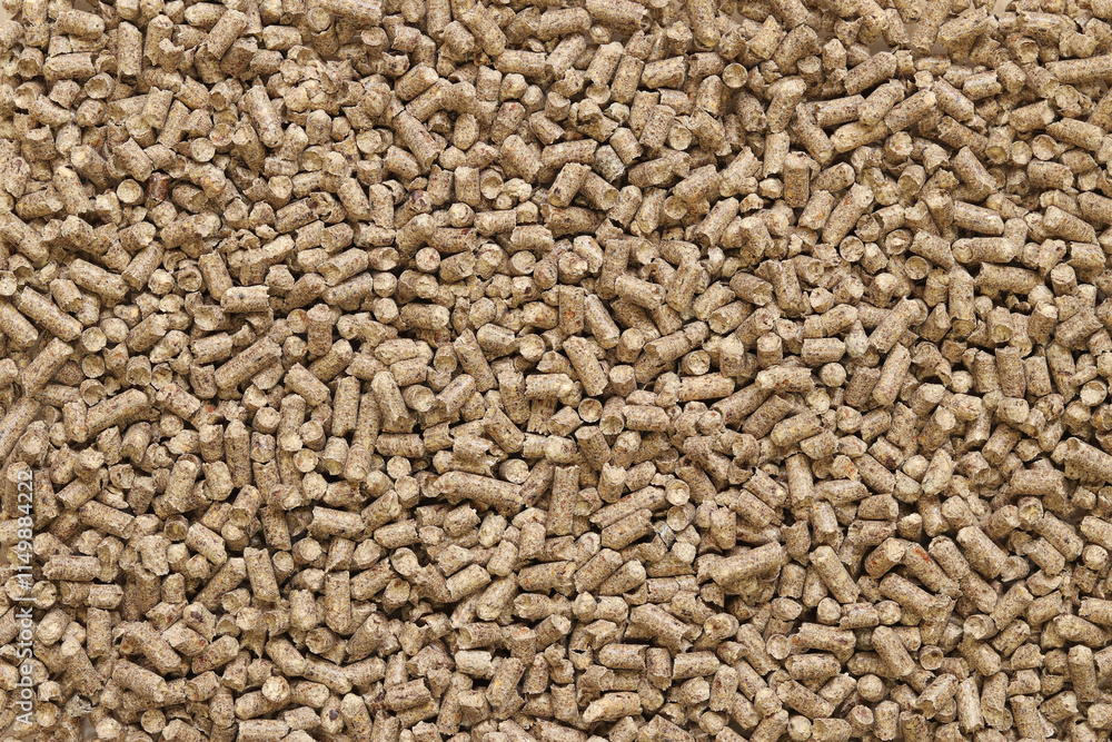 Wood filler for cat toilet, top view. Hygienic filler for pets. Pressed wood, large granules. Pellets. A pile of wood granules. Filler for dogs, cats, domestic rodents. Texture Wood filler for cat toilet, top view. Hygienic filler for pets. Pressed wood, large granules. Pellets. A pile of wood granules. Filler for dogs, cats, domestic rodents. Texture