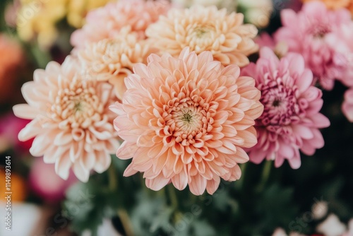 A bouquet of flowers with pink, orange, and yellow flowers