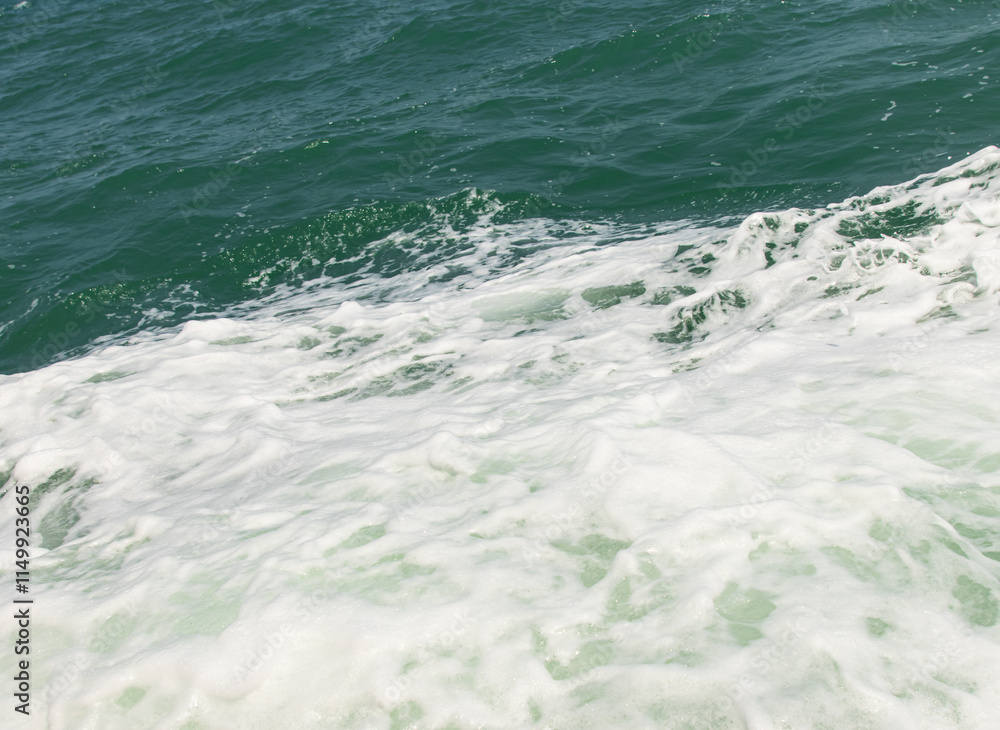 sea water with foam as background. sea water with foam as background.