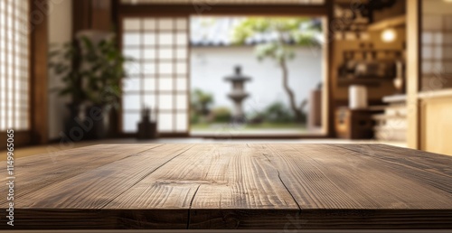 Empty wooden table in a traditional Japanese room with a blurred garden view.