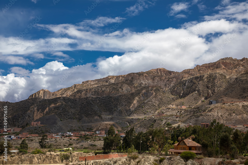 Beautiful stone mountains and valley. Rocks made of stone. Blue sky with clouds. Beautiful stone mountains and valley. Rocks made of stone. Blue sky with clouds.
