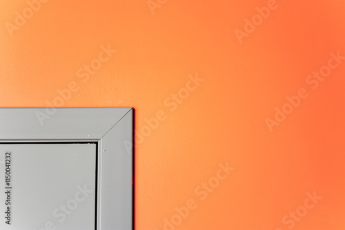 An image of the corner of a doorway on a painted wall. View of the corner of the door on the tinted wall.