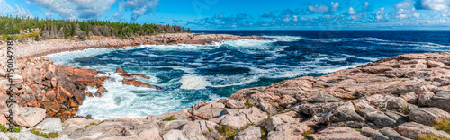 Canvas Print A panorama view of waves breaking in a rocky bay at Green cove, Ingonish on the