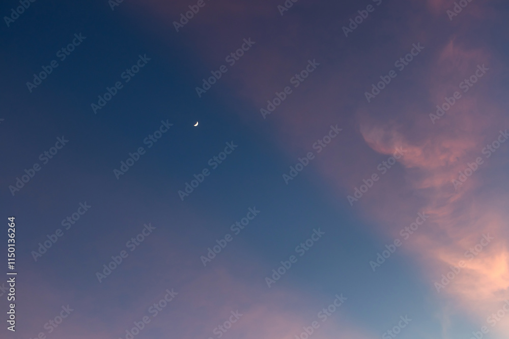 Serene twilight sky with soft cloud formations. Serene twilight sky with soft cloud formations.
