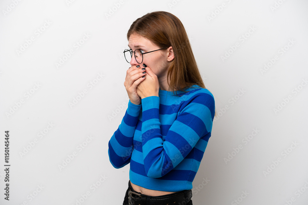 Young English woman isolated on white background covering mouth and looking to the side Young English woman isolated on white background covering mouth and looking to the side