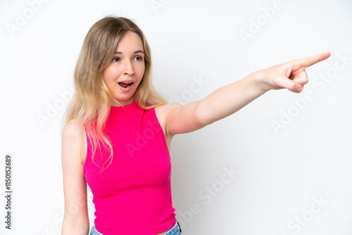 Wallpaper Mural Blonde English young girl isolated on white background pointing away Torontodigital.ca