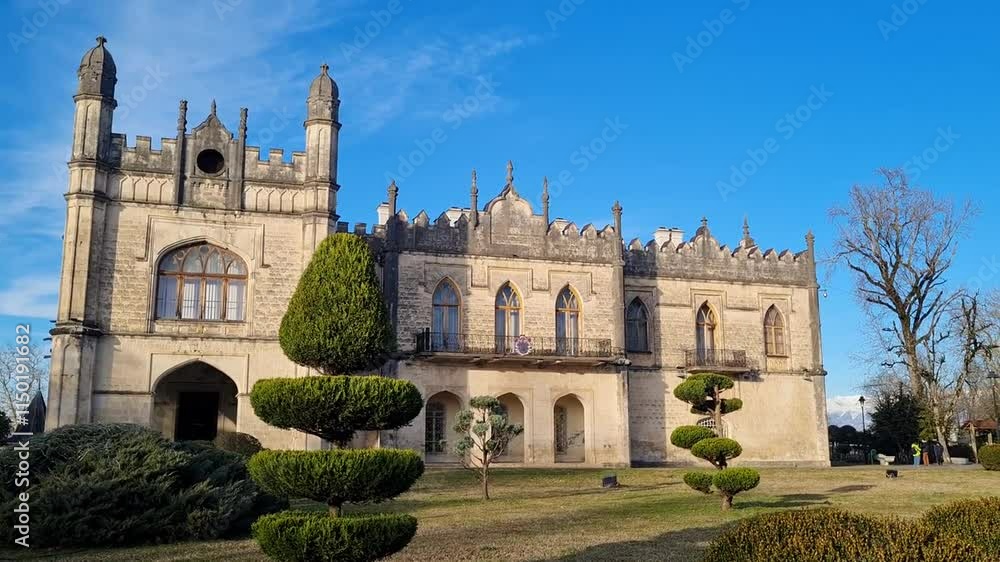 An ancient beautiful castle against the background of a blue cloudless sky. An ancient beautiful castle against the background of a blue cloudless sky.