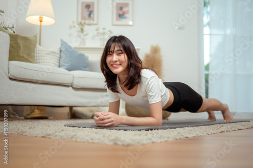 Woman Practicing Plank Exercise in Cozy Living Room Environment During Daytime photo