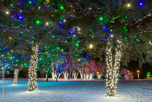 Beautiful Holiday Lights in Hudson Wisconsin downtown park along the Saint Croix River after dark with snow photo