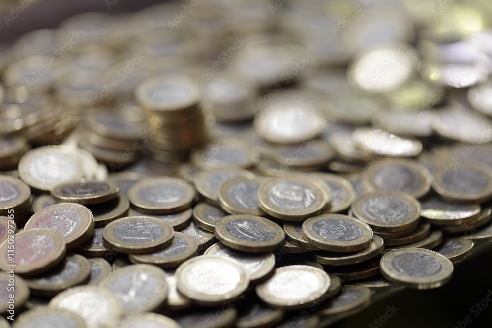 Euro coins, they just broke the savings bank. Concept of mortgage, rent, car breakdown, university studies, entrepreneurship, investment, savings, expense, unforeseen. Euro coins, they just broke the savings bank. Concept of mortgage, rent, car breakdown, university studies, entrepreneurship, investment, savings, expense, unforeseen.
