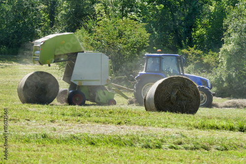 Close up of a round hay bale freshly ejected from a hay baler
