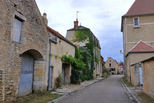 typical streets with old houses in Noyers sur Serein, France, Europe photo