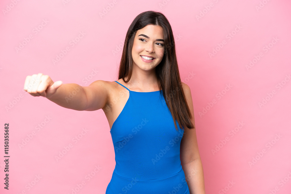 Young Brazilian woman isolated on pink background giving a thumbs up gesture Young Brazilian woman isolated on pink background giving a thumbs up gesture