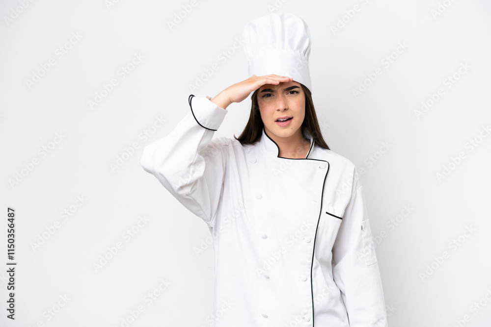 Young Brazilian chef woman isolated on white background looking far away with hand to look something Young Brazilian chef woman isolated on white background looking far away with hand to look something