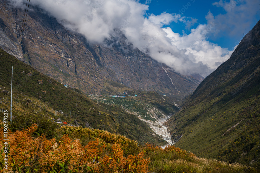 Fototapeta premium Cloudy and Foggy Mountain Peaks of Himalayas