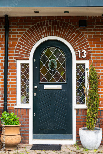 typical century Dutch door holland view in a fortified town with brick houses and front flower gardens. Typical dutch door photo