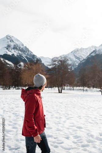 Man in Red Jacket Exploring Snowy Pyrenees Scenery photo