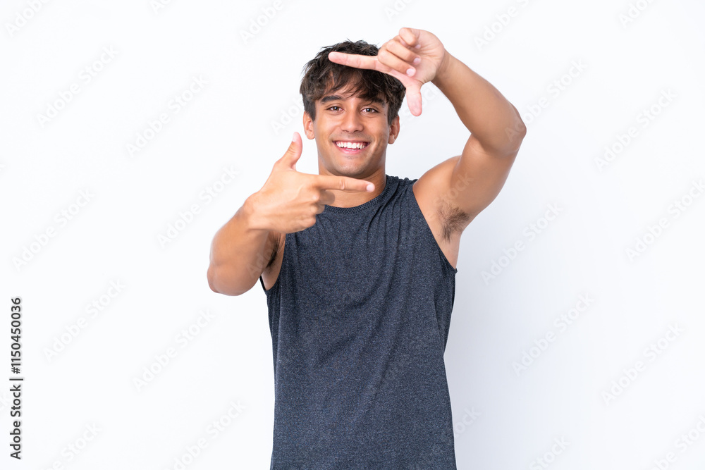 Naklejka premium Young sport caucasian man isolated on white background focusing face. Framing symbol