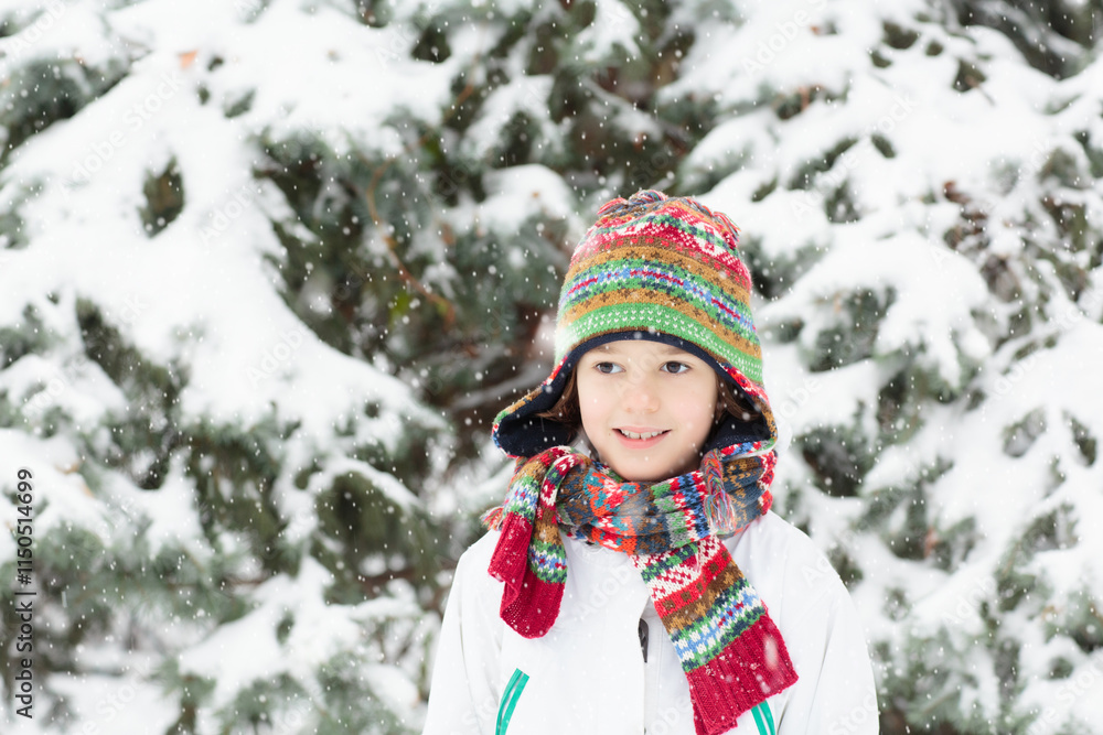 Kids play in snow in winter park Kids play in snow in winter park